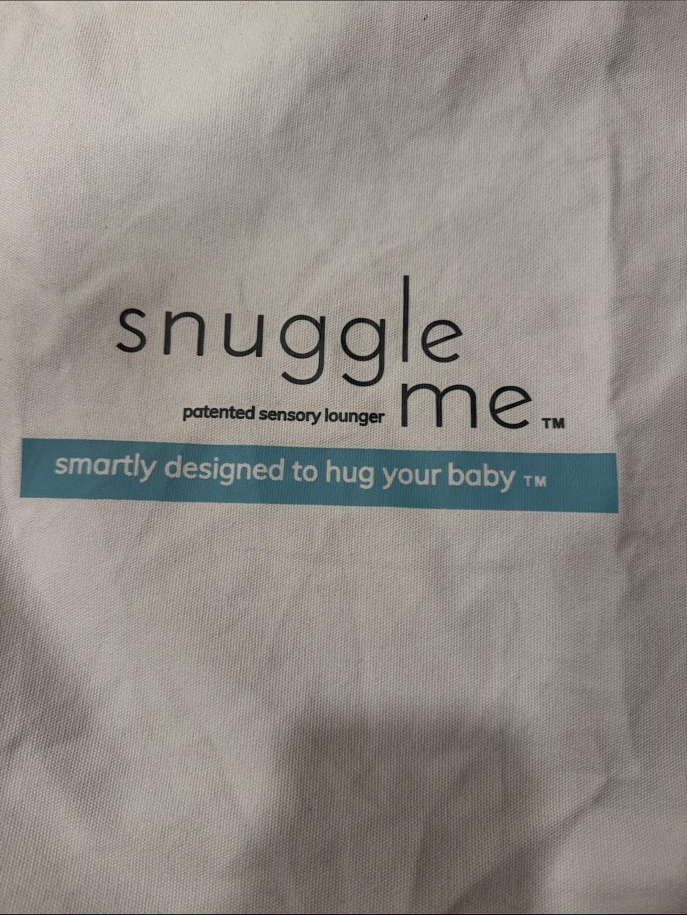 Snuggle Me patented sensory lounger pillow to hug your baby